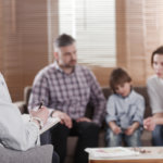 Two divorced parents and son in mediation to figure out the best parenting plan