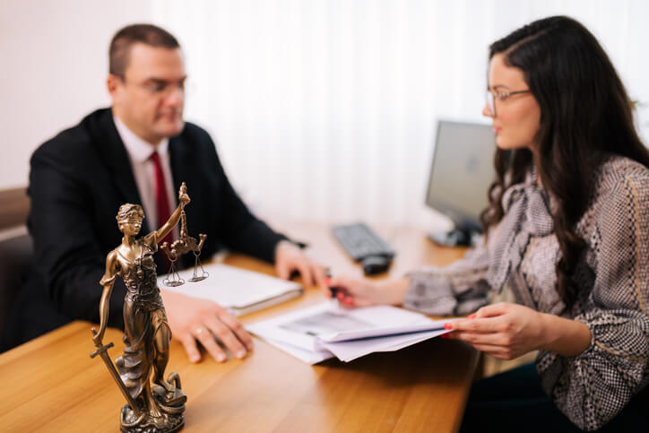 Woman meeting with employment law attorney
