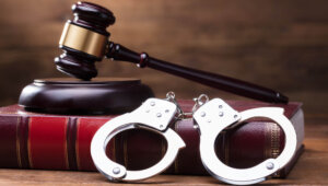Gavel and Handcuffs on a Law Book